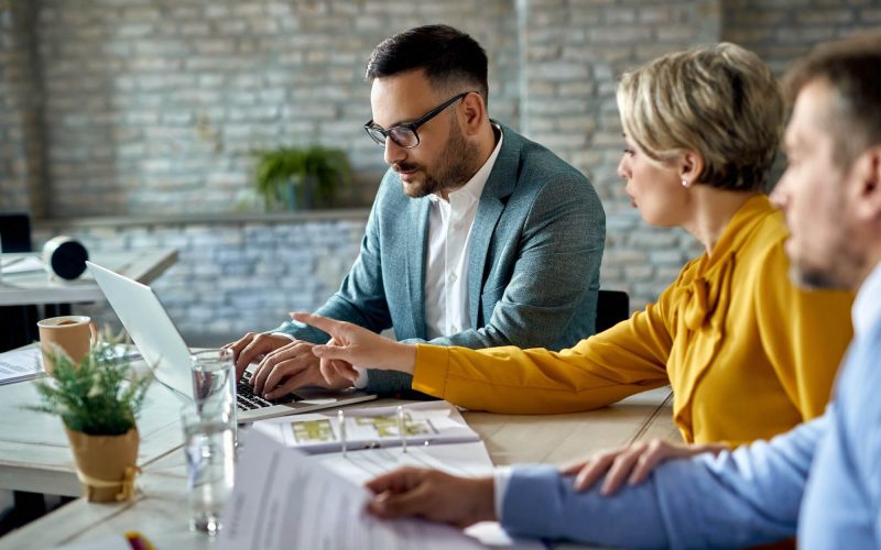real-estate-agent-using-laptop-while-having-a-meeting-with-a-couple-in-the-office-1-1.jpg real-estate-agent-using-laptop-while-having-a-meeting-with-a-couple-in-the-office-1-1.jpg